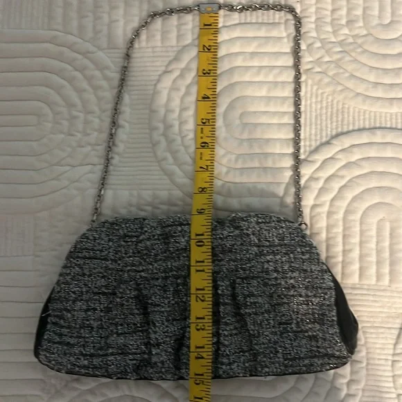 Shades of woven gray, and silver and black leather trim.Removable silver chain